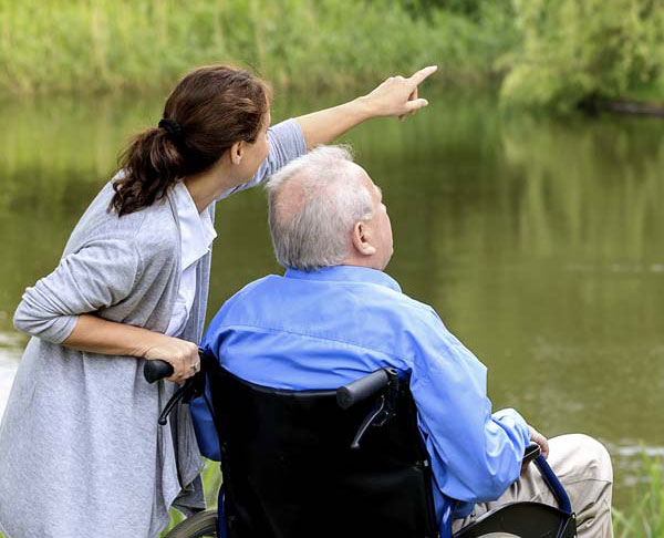 Caregiver with man in wheelchair
